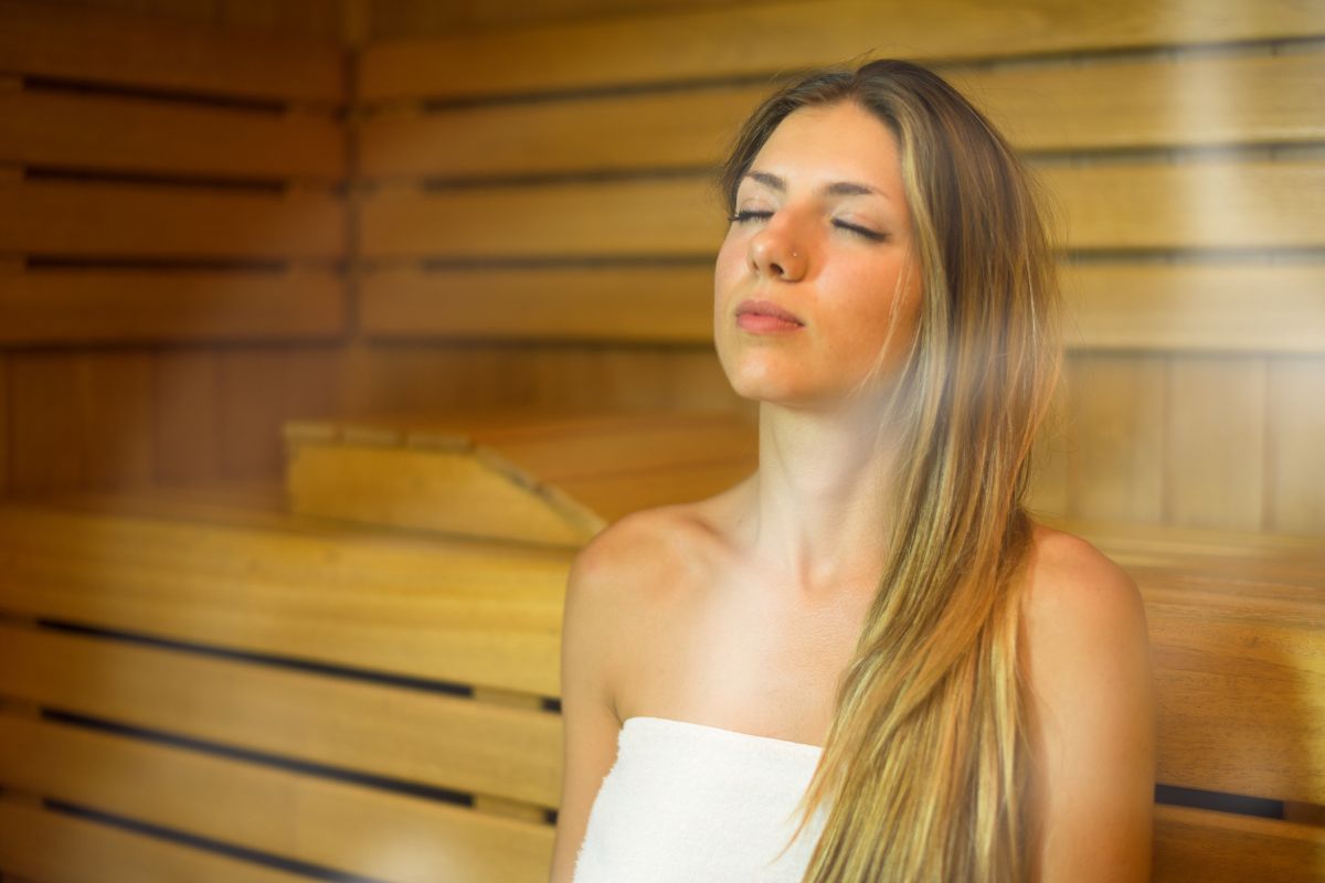 Professional unwinding during an infrared sauna session after a busy day